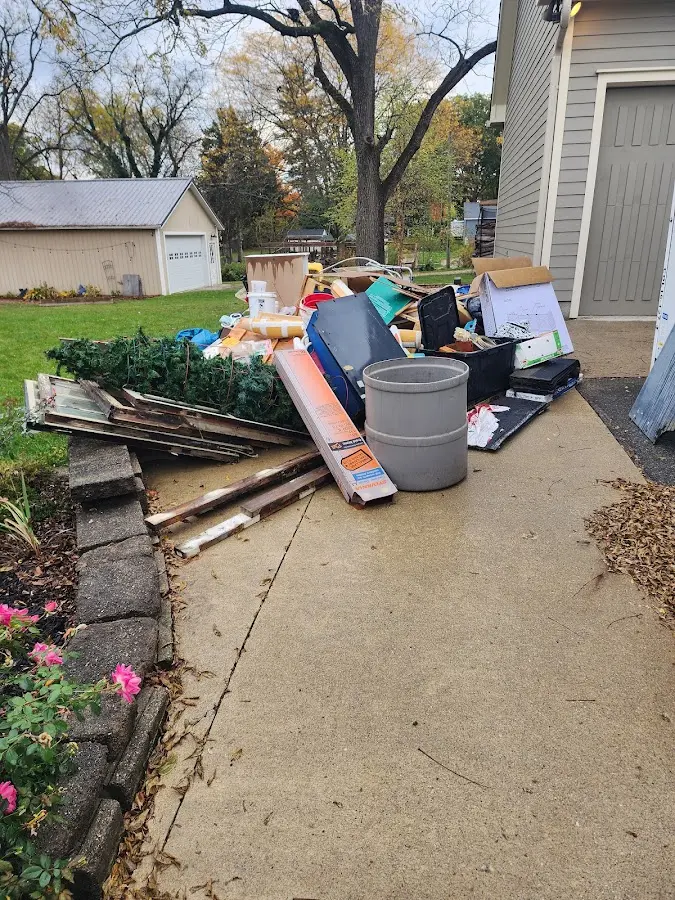 Dumpster being loaded with debris for 3 Yard Dumpster Rental in Suffern